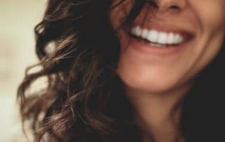 Woman with white teeth smiling
